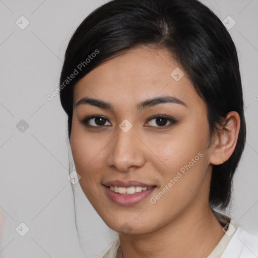 Joyful asian young-adult female with medium  brown hair and brown eyes