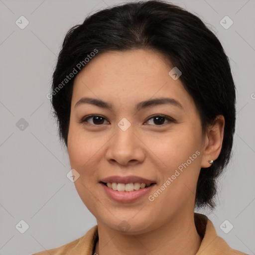 Joyful latino young-adult female with medium  brown hair and brown eyes