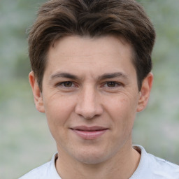 Joyful white adult male with short  brown hair and brown eyes