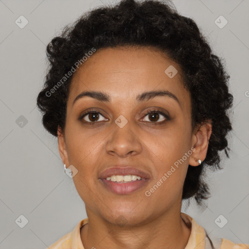 Joyful black young-adult female with short  brown hair and brown eyes