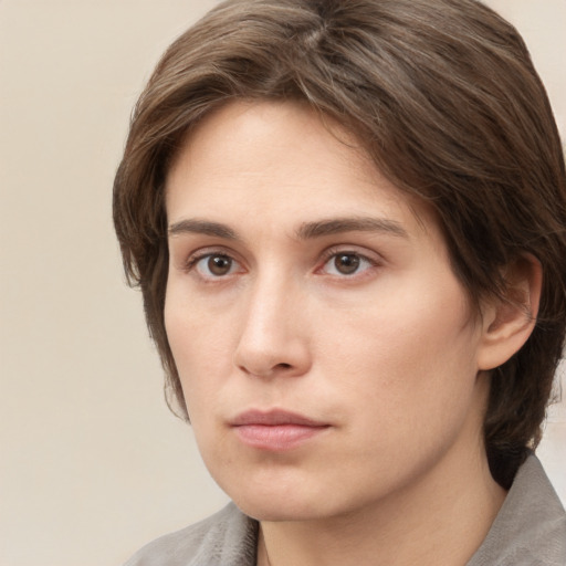 Neutral white young-adult female with medium  brown hair and grey eyes