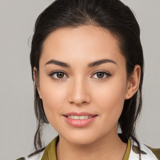 Joyful white young-adult female with medium  brown hair and brown eyes