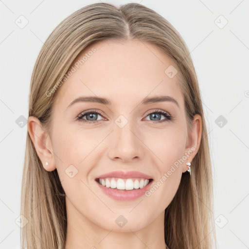 Joyful white young-adult female with long  brown hair and blue eyes