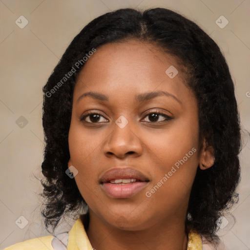 Joyful black young-adult female with medium  black hair and brown eyes