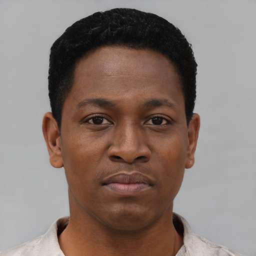 Neutral black young-adult male with short  black hair and brown eyes