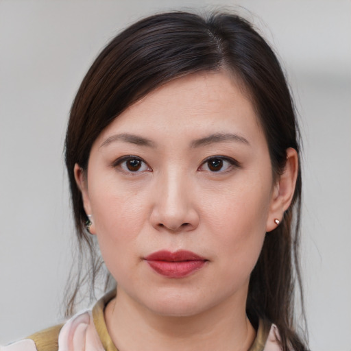 Joyful white young-adult female with medium  brown hair and brown eyes