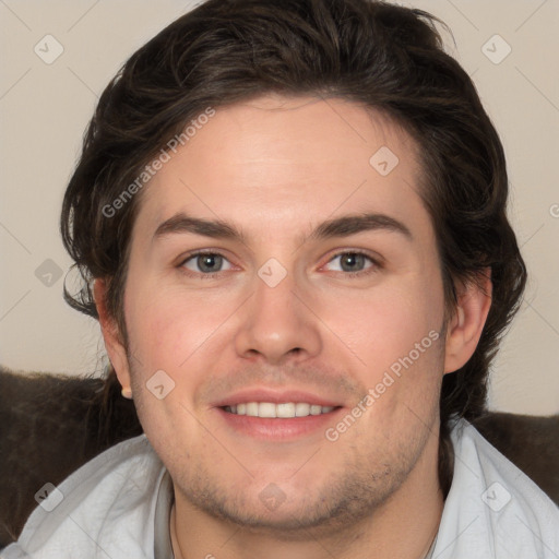 Joyful white young-adult male with medium  brown hair and brown eyes