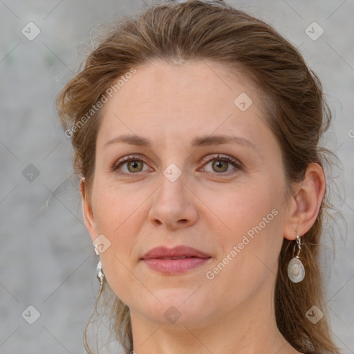 Joyful white adult female with medium  brown hair and grey eyes