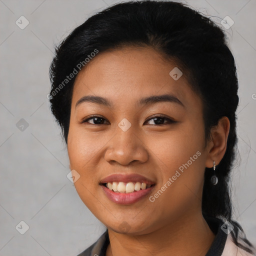 Joyful latino young-adult female with short  black hair and brown eyes