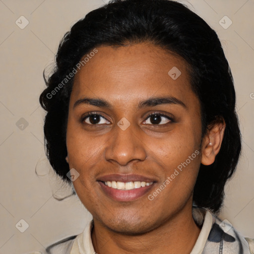 Joyful black young-adult female with medium  black hair and brown eyes