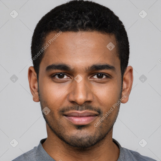 Joyful black young-adult male with short  black hair and brown eyes