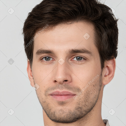 Neutral white young-adult male with short  brown hair and brown eyes