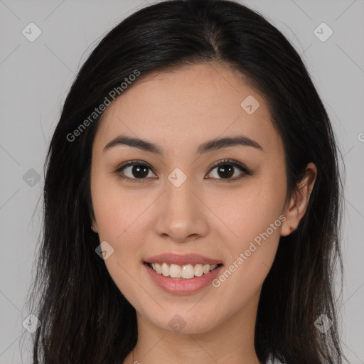 Joyful asian young-adult female with long  brown hair and brown eyes