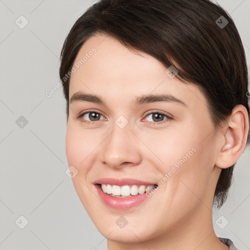 Joyful white young-adult female with medium  brown hair and brown eyes