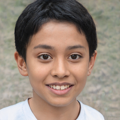 Joyful latino child female with short  brown hair and brown eyes