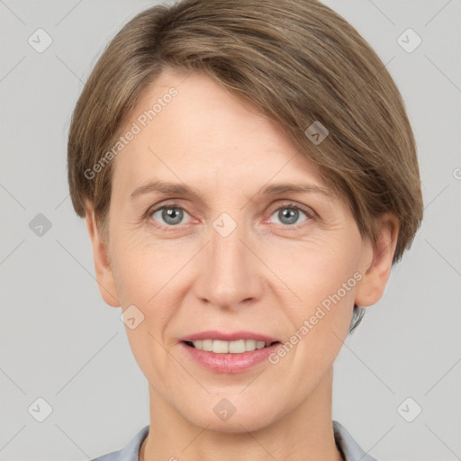 Joyful white adult female with short  brown hair and grey eyes