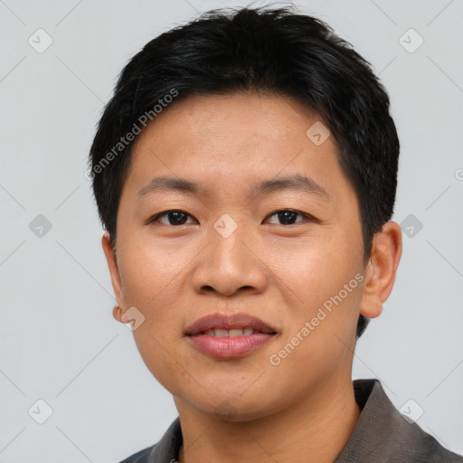 Joyful asian young-adult male with short  black hair and brown eyes