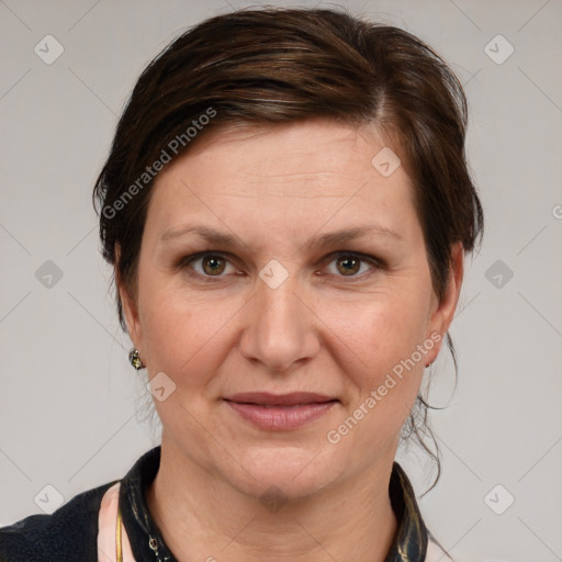 Joyful white adult female with medium  brown hair and grey eyes