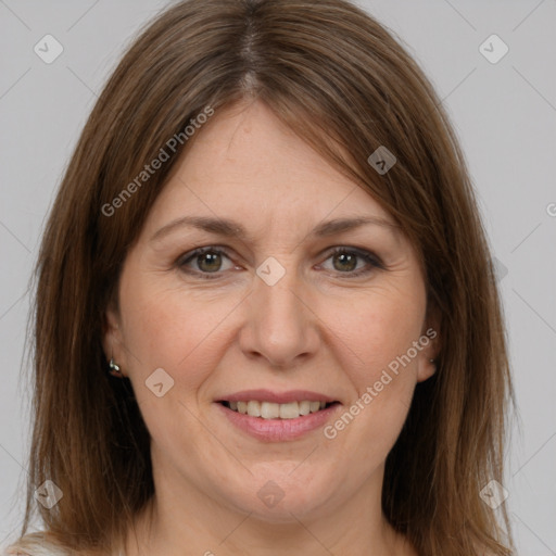 Joyful white adult female with medium  brown hair and brown eyes