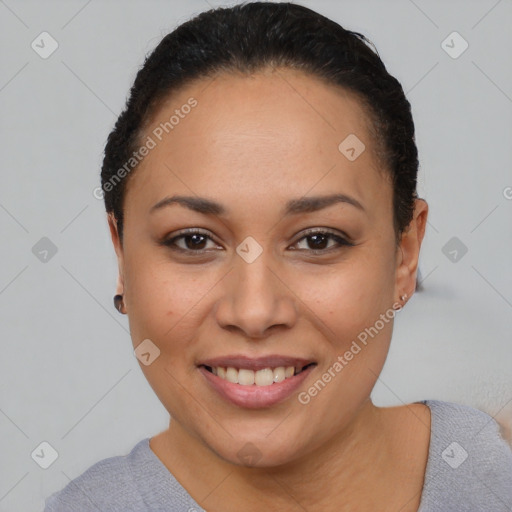 Joyful latino young-adult female with short  black hair and brown eyes