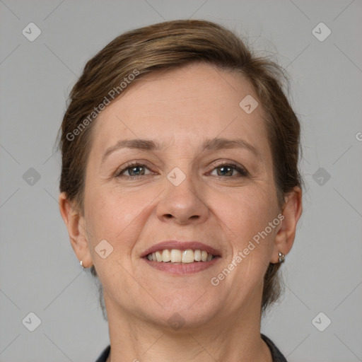 Joyful white adult female with short  brown hair and grey eyes