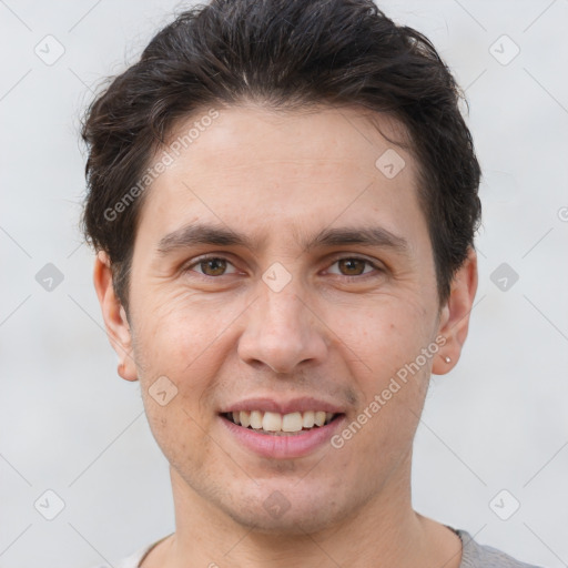 Joyful white young-adult male with short  brown hair and brown eyes