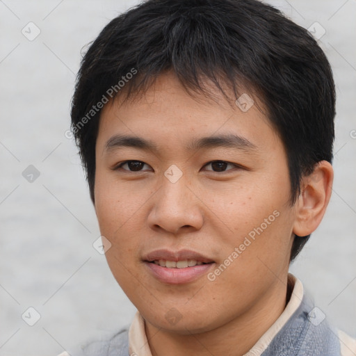 Joyful asian young-adult male with short  brown hair and brown eyes