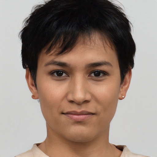 Joyful white young-adult female with short  black hair and brown eyes