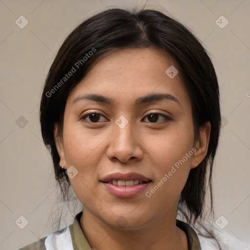 Joyful latino young-adult female with medium  brown hair and brown eyes