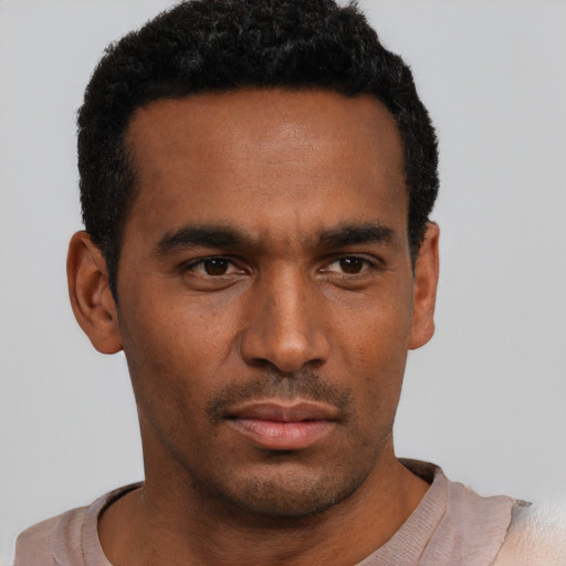 Neutral black young-adult male with short  black hair and brown eyes