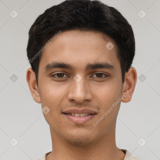 Joyful latino young-adult male with short  brown hair and brown eyes