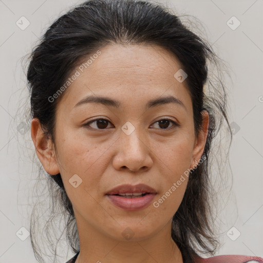 Joyful asian adult female with medium  brown hair and brown eyes