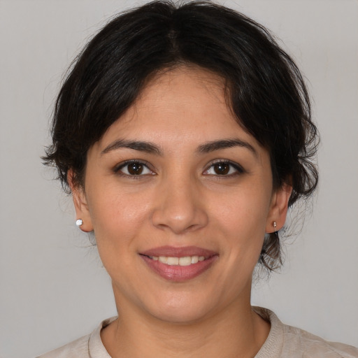 Joyful white young-adult female with medium  brown hair and brown eyes