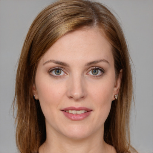 Joyful white young-adult female with medium  brown hair and green eyes