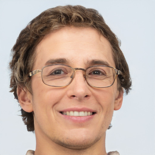 Joyful white adult male with short  brown hair and green eyes