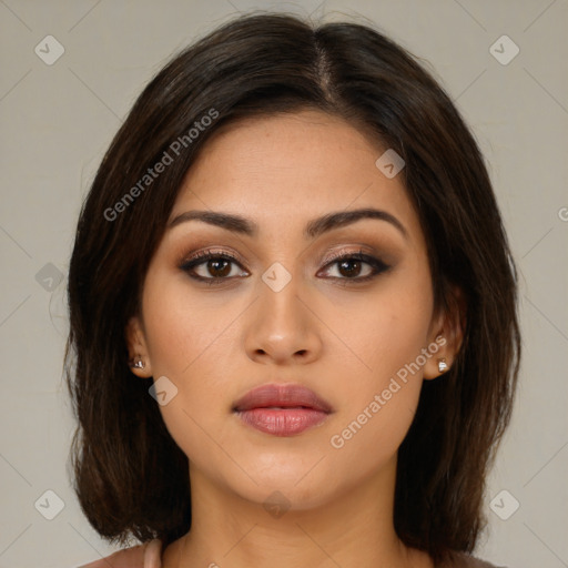 Neutral latino young-adult female with medium  brown hair and brown eyes