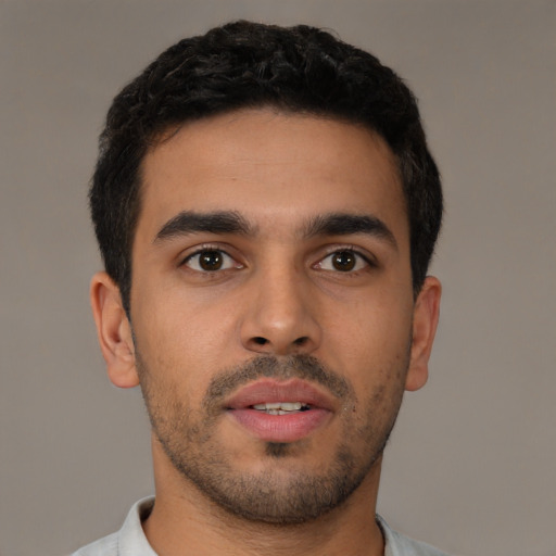 Neutral latino young-adult male with short  brown hair and brown eyes