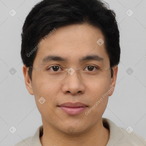 Joyful asian young-adult male with short  black hair and brown eyes