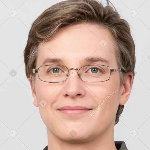 Joyful white adult male with short  brown hair and grey eyes