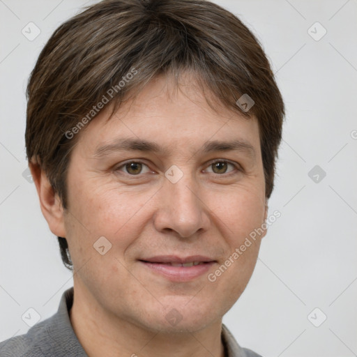 Joyful white adult male with short  brown hair and grey eyes