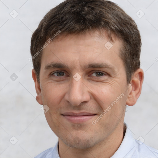 Joyful white adult male with short  brown hair and brown eyes