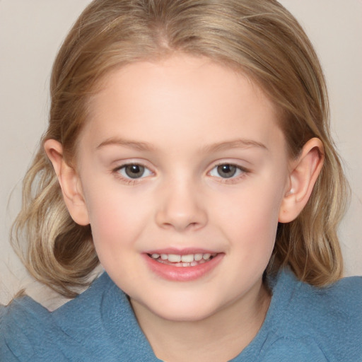 Joyful white child female with medium  brown hair and blue eyes