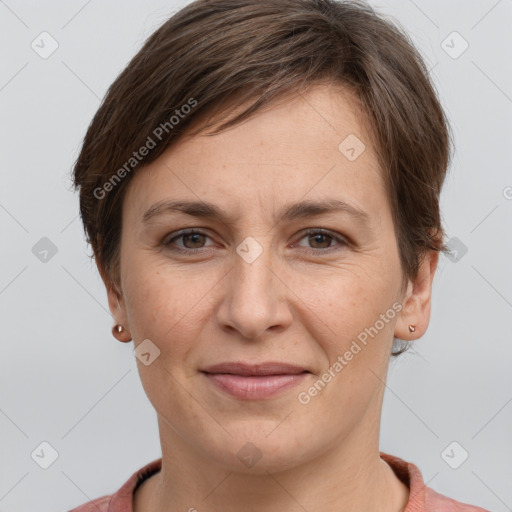 Joyful white adult female with short  brown hair and grey eyes