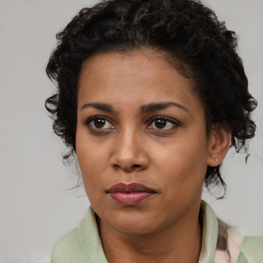 Neutral latino young-adult female with short  brown hair and brown eyes