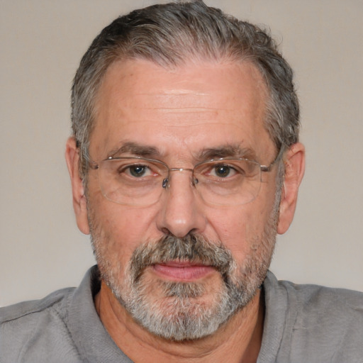 Neutral white middle-aged male with short  gray hair and brown eyes