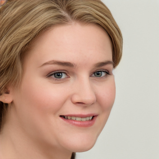 Joyful white young-adult female with long  brown hair and blue eyes