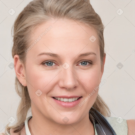 Joyful white young-adult female with long  brown hair and blue eyes