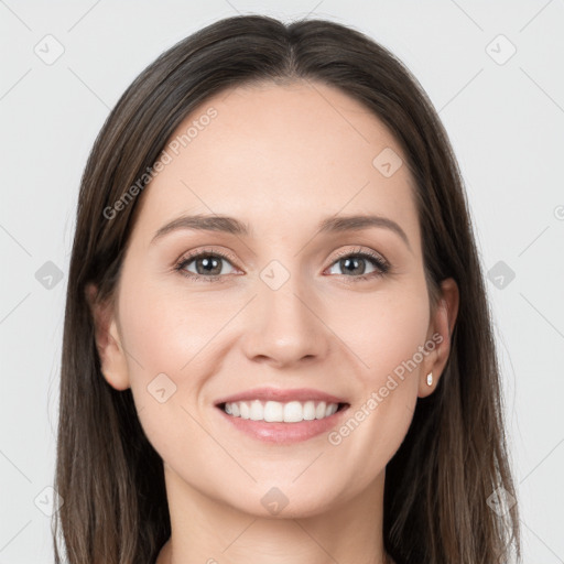 Joyful white young-adult female with long  brown hair and grey eyes