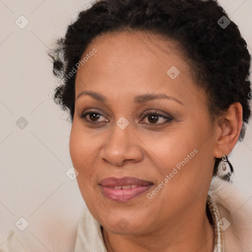 Joyful black adult female with short  brown hair and brown eyes