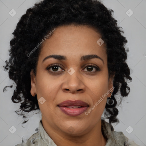 Joyful black adult female with medium  brown hair and brown eyes